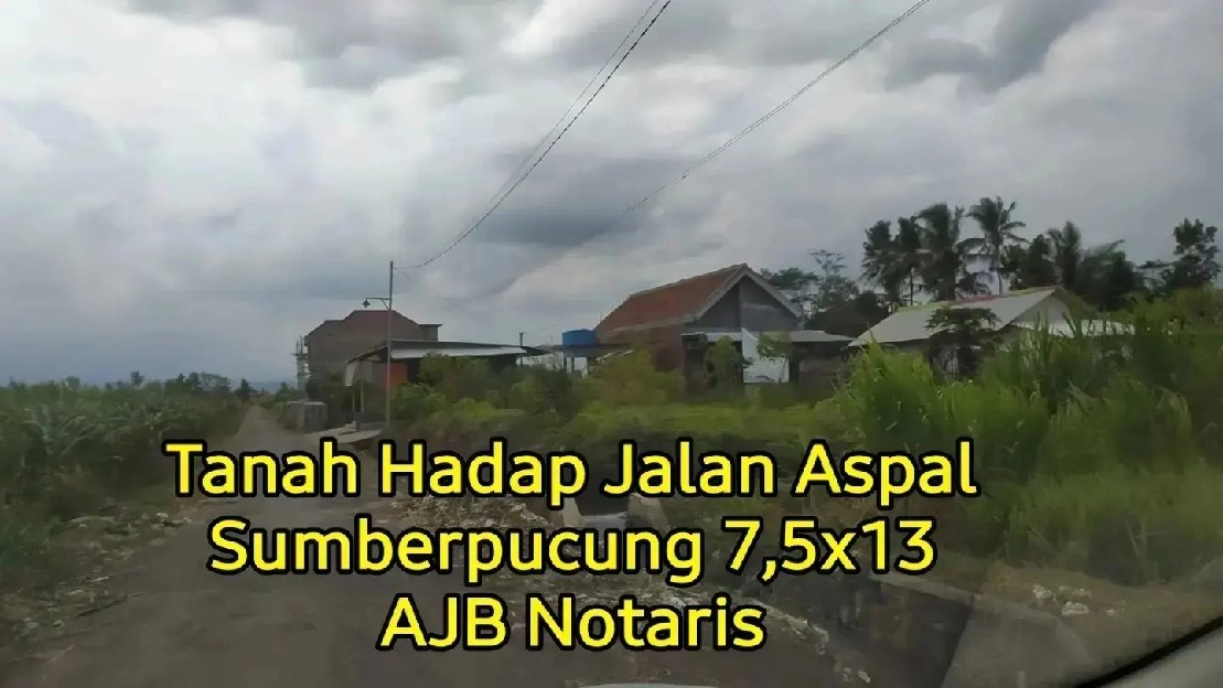 TANAH HADAP JALAN ASPAL MALANG